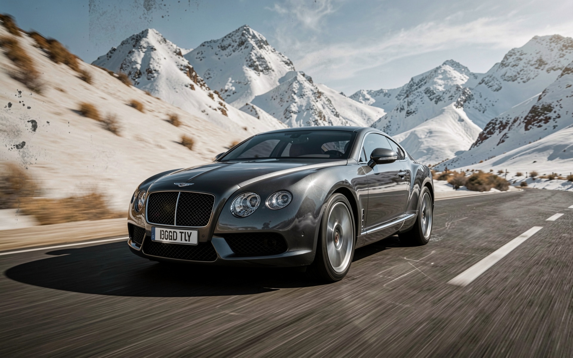 Серый Bentley Continental GT заснеженные горы