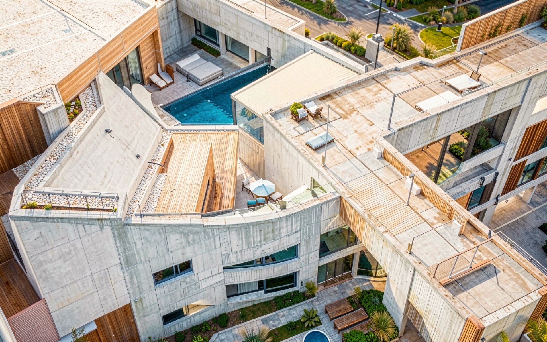 Современный бетонный дом с бассейном и террасами