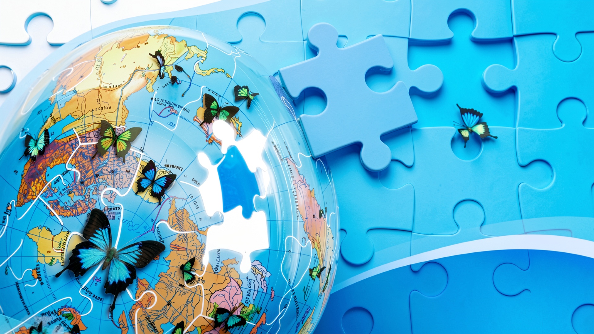Глобус с синими бабочками на пазлах