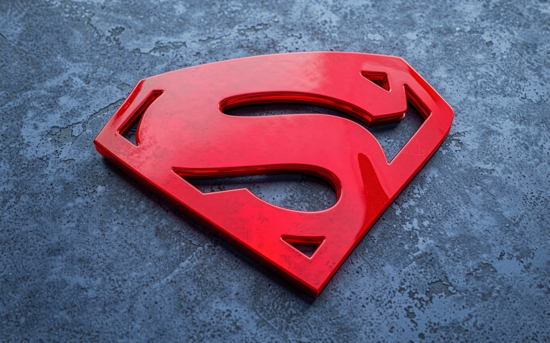 Красный логотип Супермена на темно-сером фоне